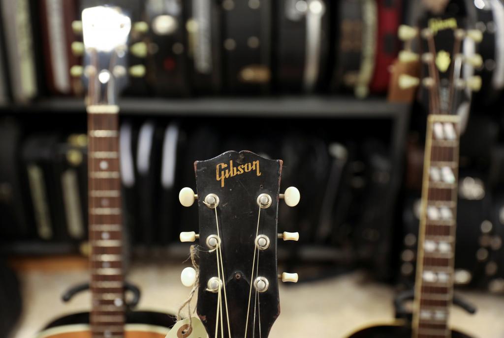 FILE PHOTO: The headstock and tuners of a Gibson guitar is seen seen inside the vintage guitars shop 